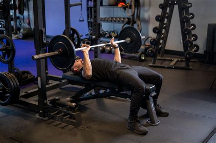 Can you do bench press on a bed?