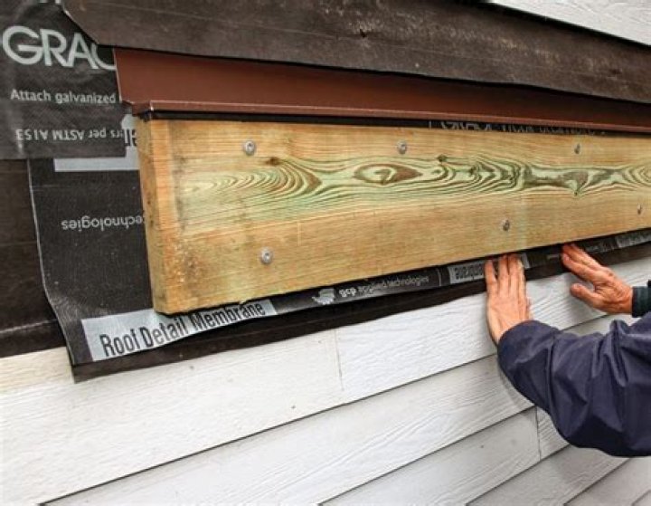 Can you put a ledger board over siding?