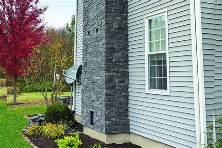 Can you put stacked stone over exterior brick?