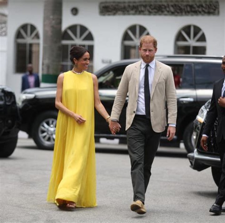	Duchess Meghan wore H&M, custom Armani to her first official visit to Mayhew	