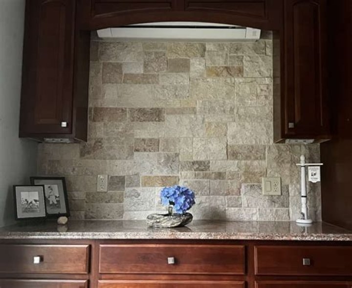 How do you clean natural stone backsplash?