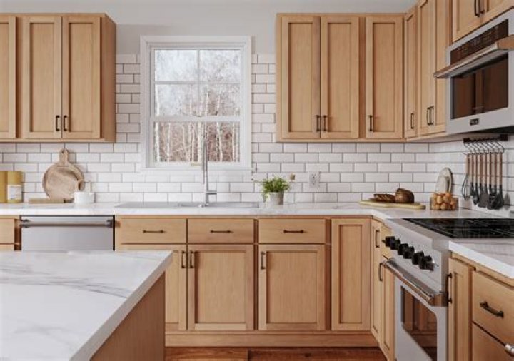 How do you finish unfinished oak kitchen cabinets?