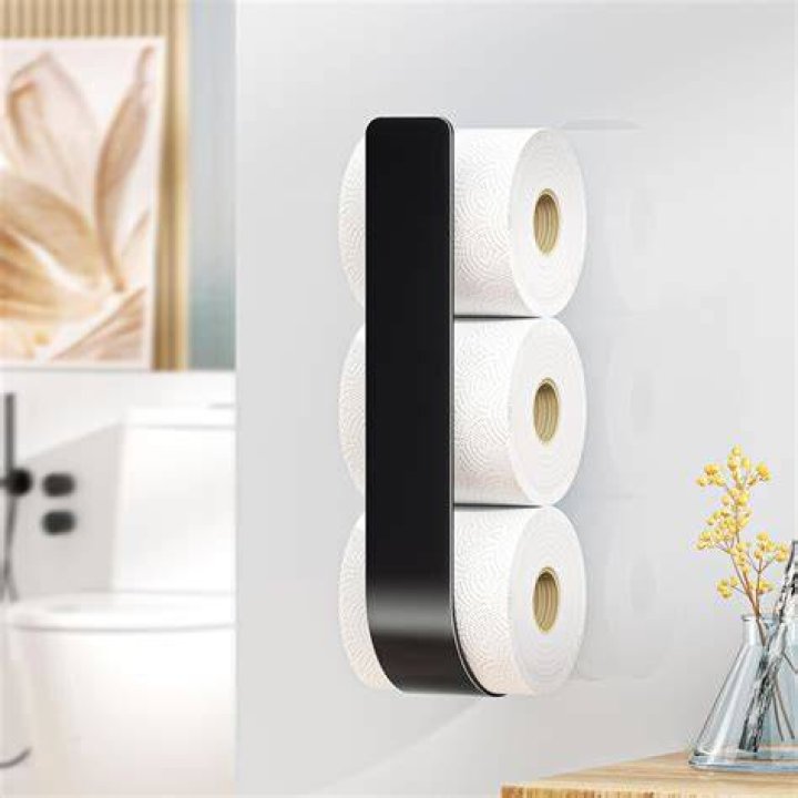 How do you open a public toilet paper holder?