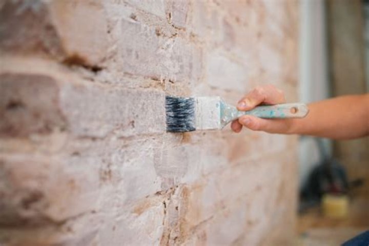How do you paint a brick foundation?