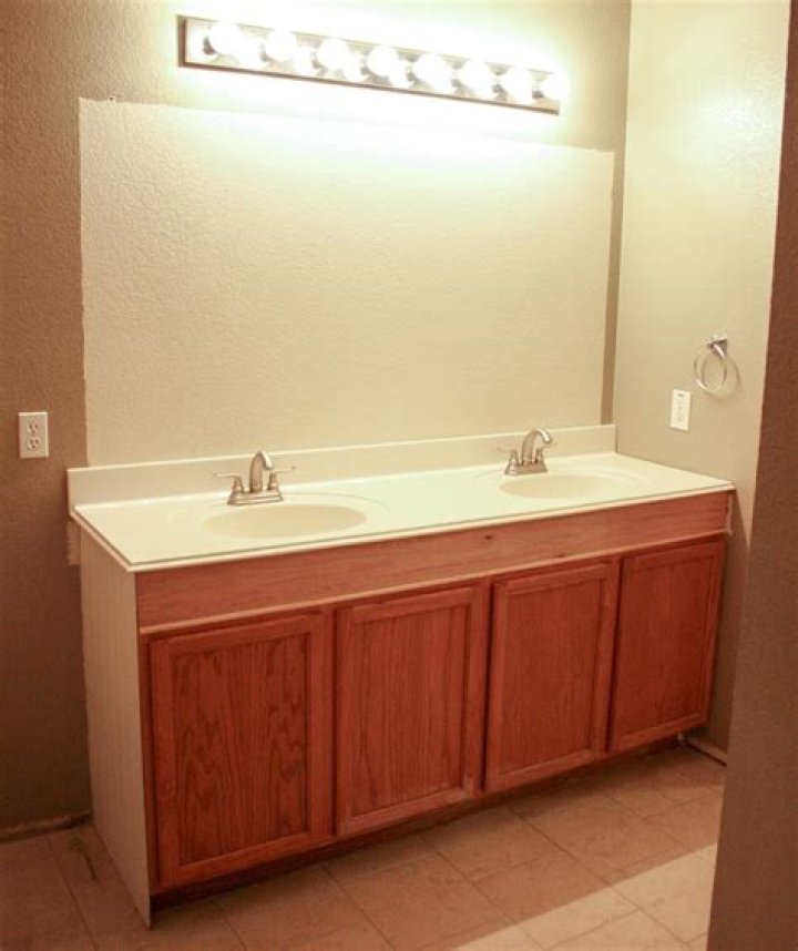 How do you raise a short vanity?