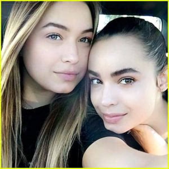 How old is Sofia Carson's sister?