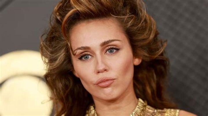 Miley Cyrus shows off her new grill with a gold tooth: rebellious or just sad?