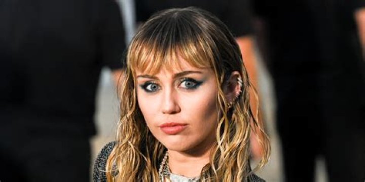 Miley Cyrus wore Maison Margiela & huge hair to the 2024 Grammys