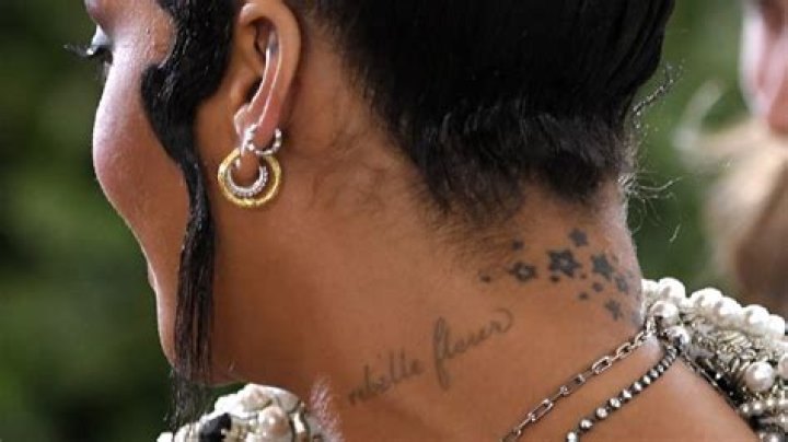 Rihanna says her “Rebelle Fleur” neck tattoo wasn’t a mistake