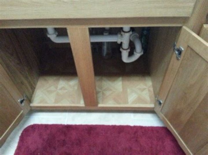 Should you tile under cabinets?