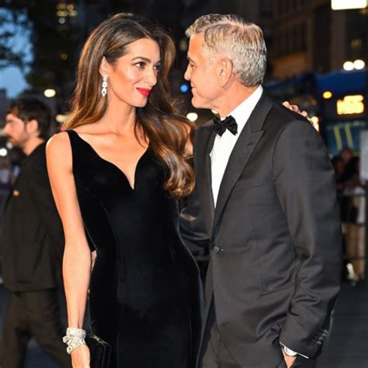 Stacy Keibler in McQueen, with George Clooney: overworked and busted?