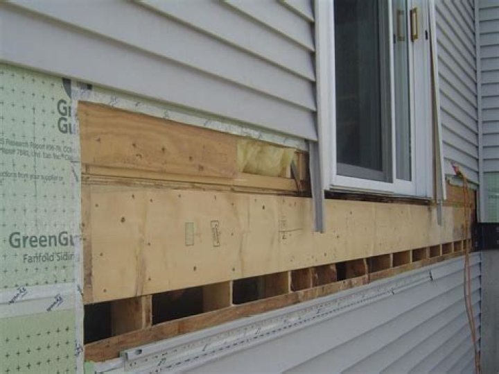 What is behind vinyl siding?
