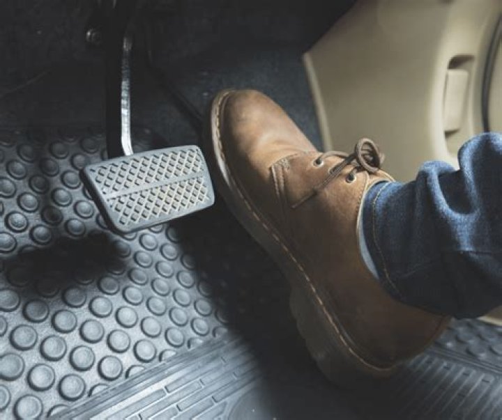 What should you do if you experience a jammed gas pedal?