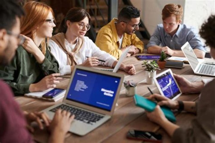 Why is it important for teams to have frequent meetings?